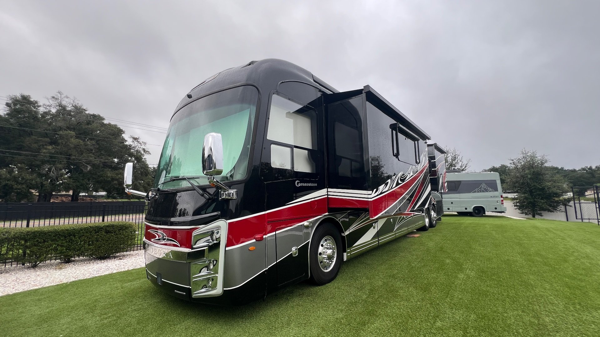 2021 Entegra Coach Cornerstone 45B — The front and passenger-side exterior of the motorhome