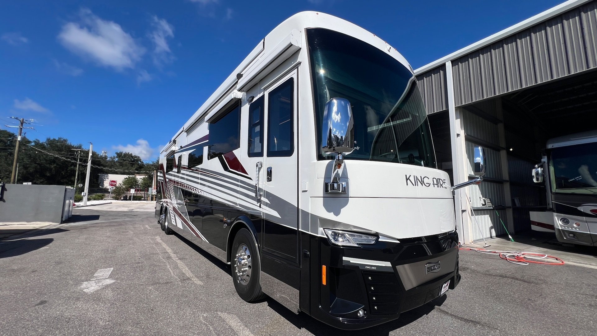 2025 Newmar King Aire 4558 — Visible front and side of the King Aire motorhome outdoors