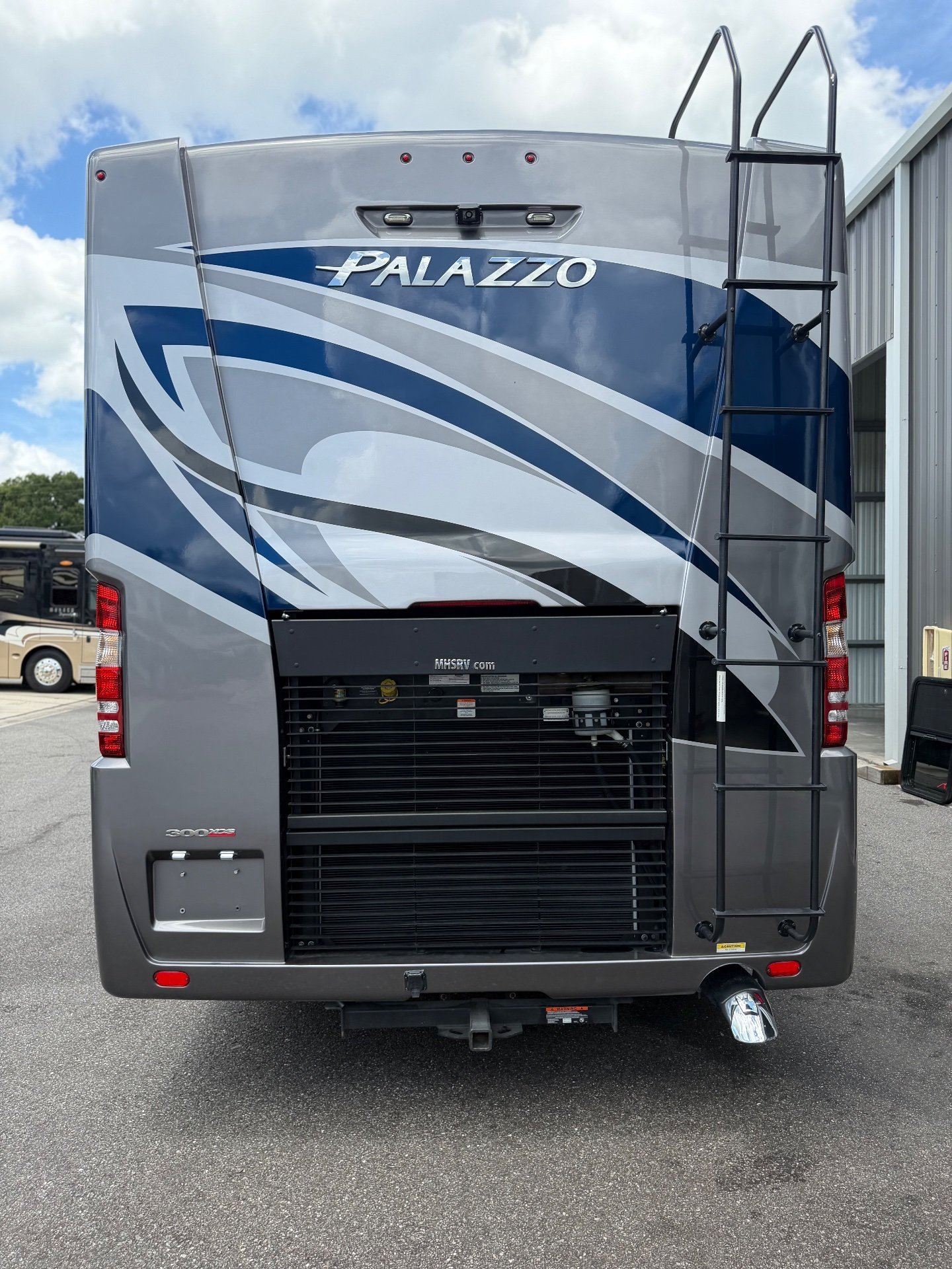 2022 Thor Motor Coach Palazzo 33.5 — The full rear exterior, engine grille, ladder, lights, and hitch