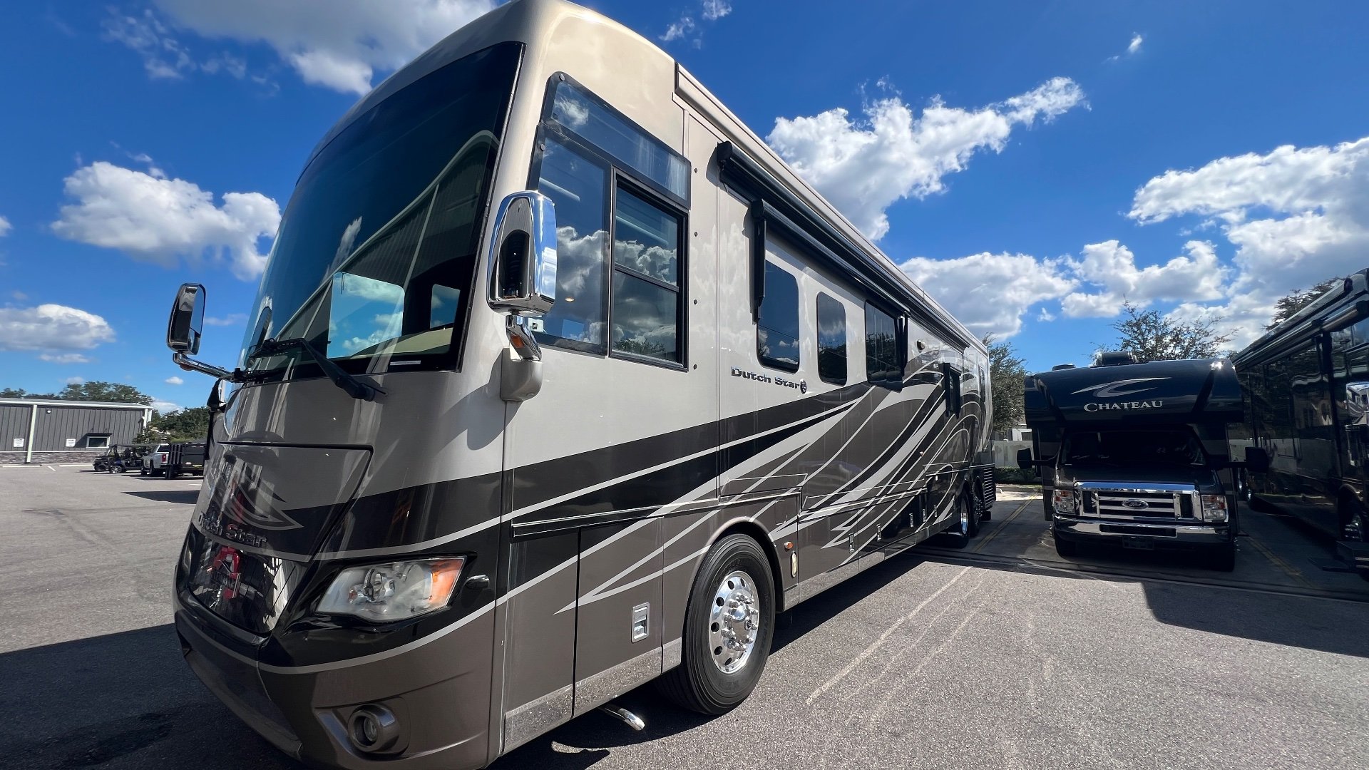 2018 Newmar Dutch Star 4369 — Photograph clearly shows the outside front and side of a Dutch Star motorhome