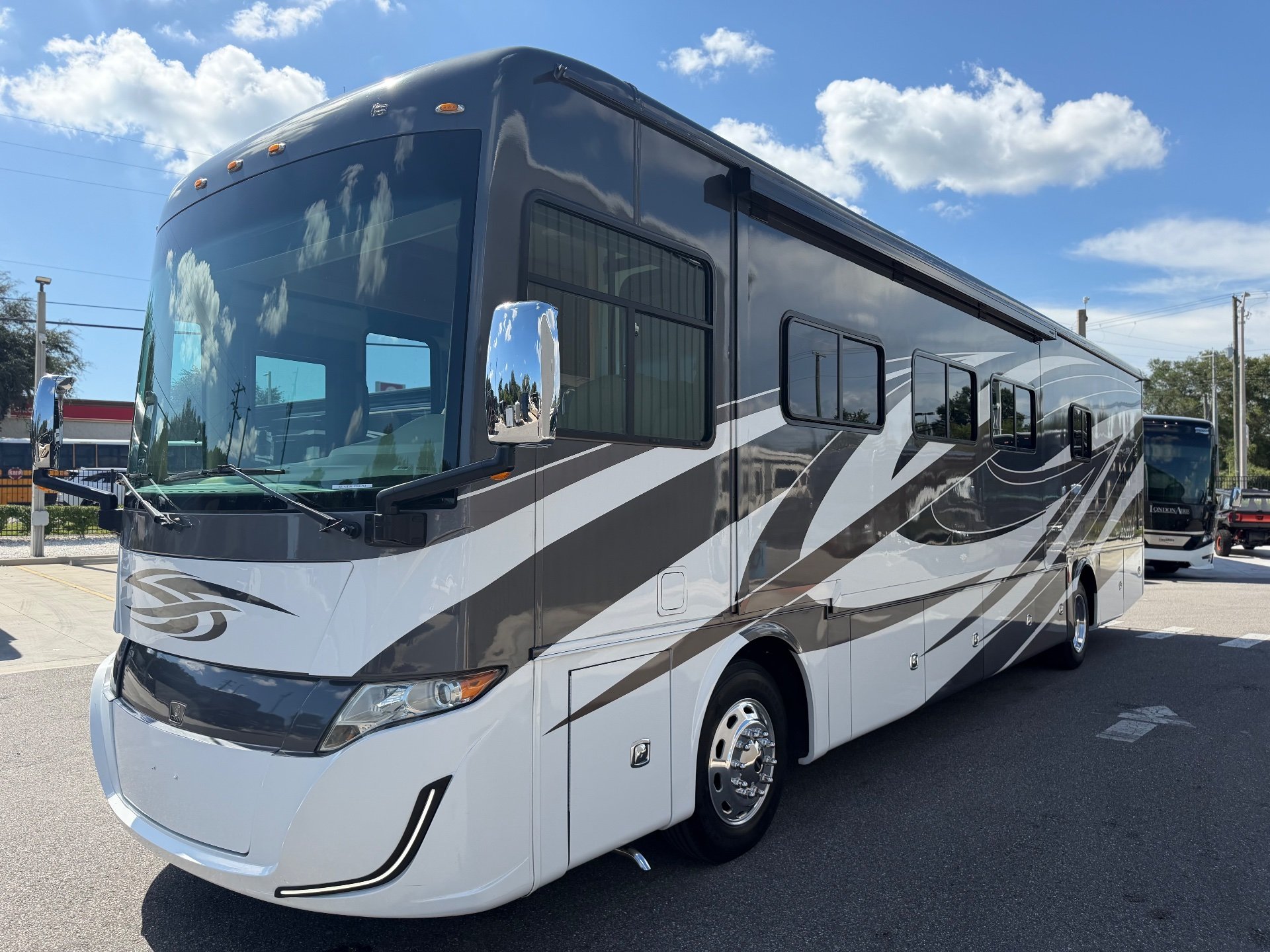 2021 Tiffin Allegro Red 340 38 LL — The exterior front and passenger side of the motorhome