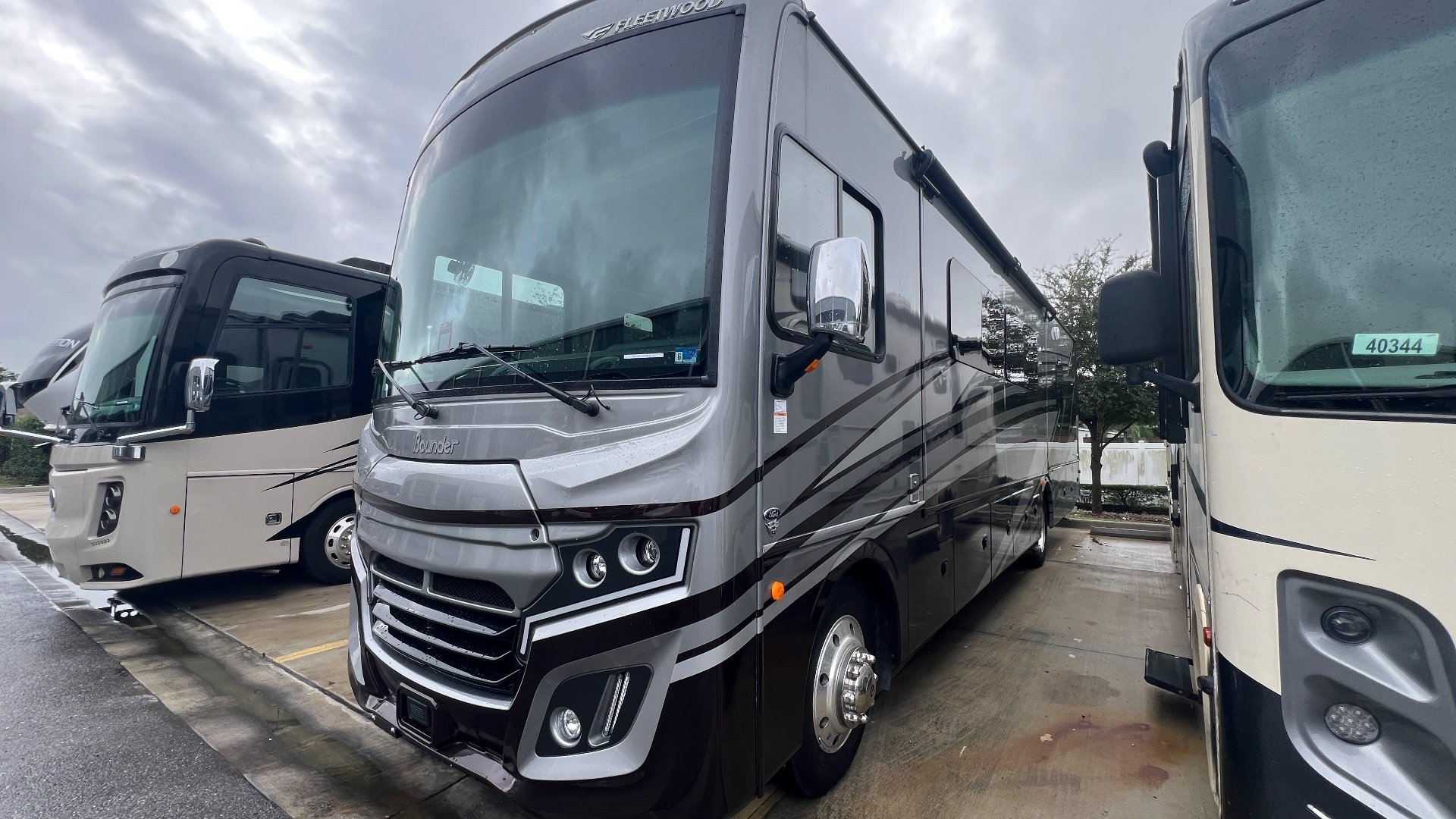 2024 Fleetwood Bounder 35K — The motorhome's front exterior, windshield, body panels, mirrors, and front wheel