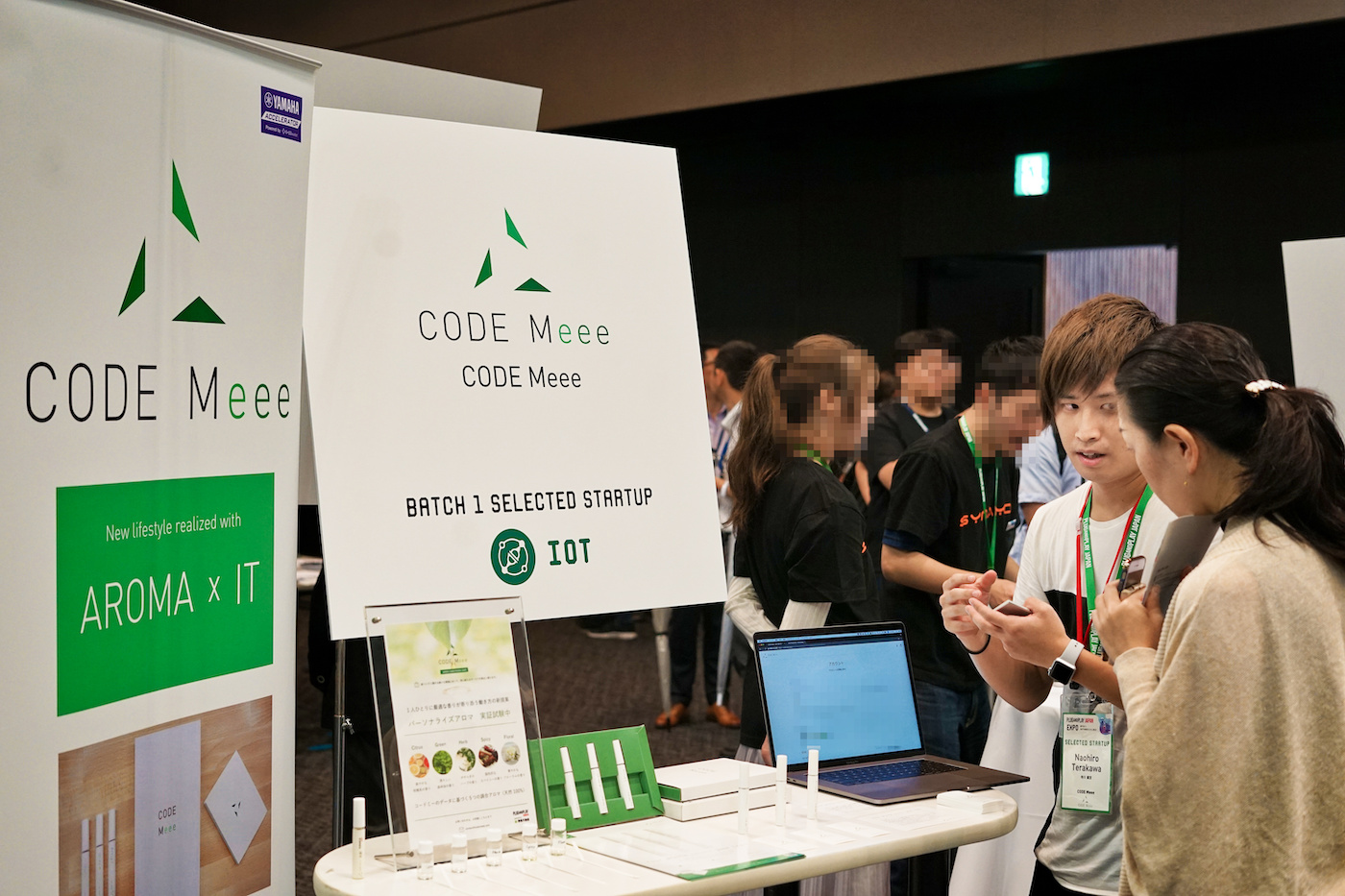Photo of Terakawa introducing CODE Meee