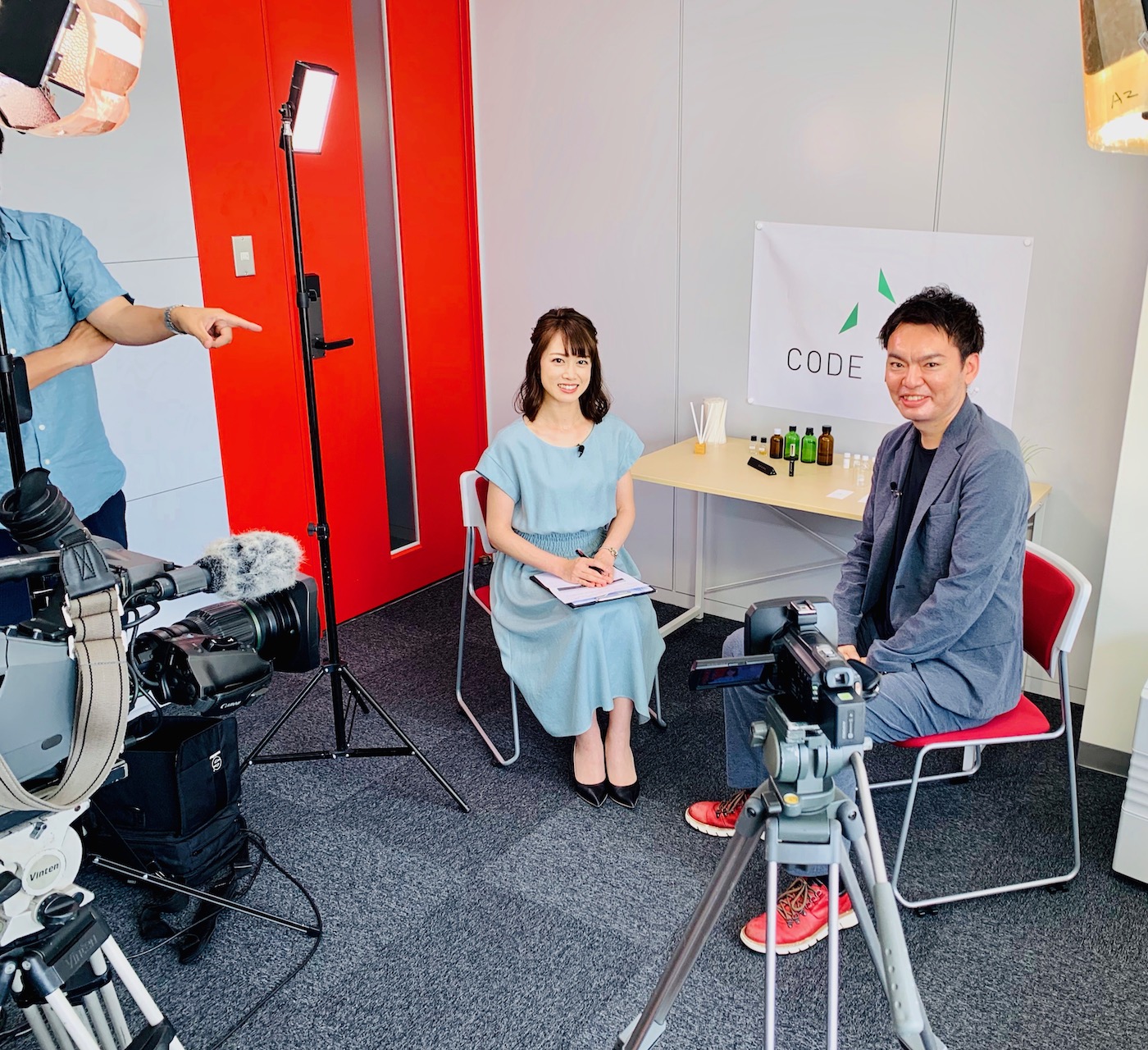 Photo of Kenji being interviewed