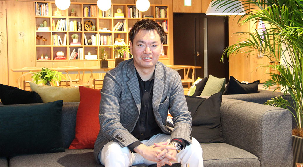 Photo of Kenji being interviewed
