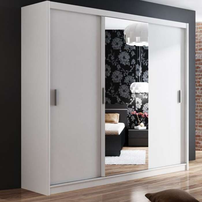 The sliding door wardrobe MONAKO 250cm white with mirrored door in a cosy bedroom.