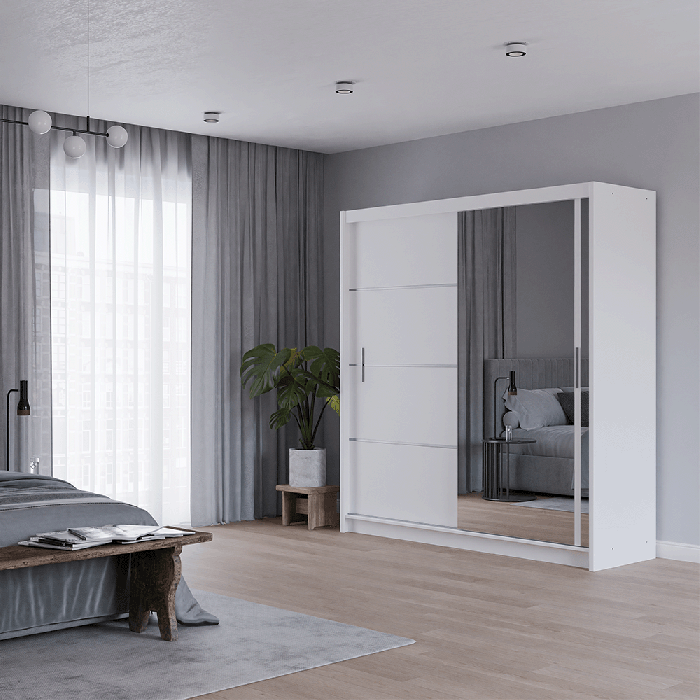 The sliding door VISTA 203cm white with mirrored door in a cosy bedroom.