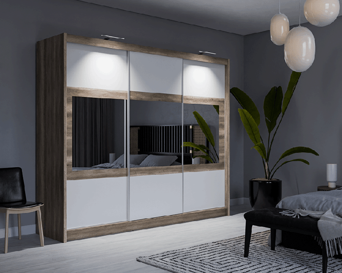 The sliding door wardrobe SALWADOR 250cm oak canyon + white with horizontal mirrors on doors and LED light in a cosy bedroom