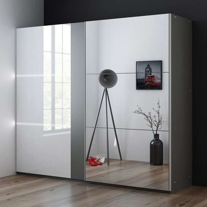 The sliding door wardrobe TUNIS 250cm graphite with mirrored door and white gloss door.