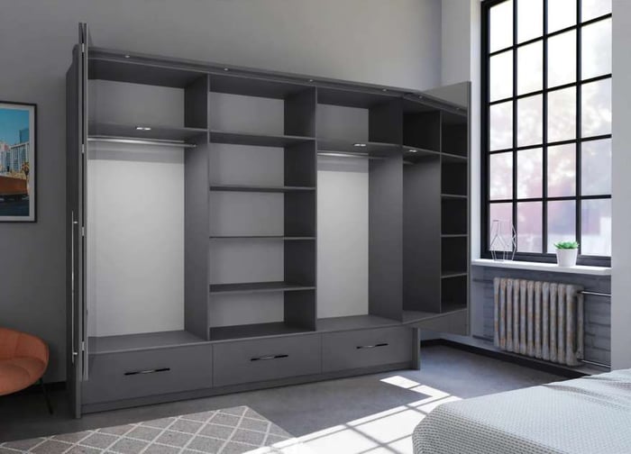 The interior of the TOLEDO 255cm wardrobe graphite presenting 6 shelves, 2 hanging rails, and 3 exterior drawers with the bi-folding doors, 