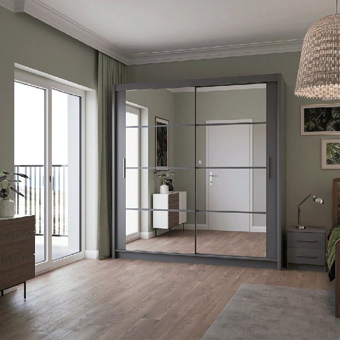 The sliding door DAKOTA 203cm graphite with mirrors in a cosy bedroom.