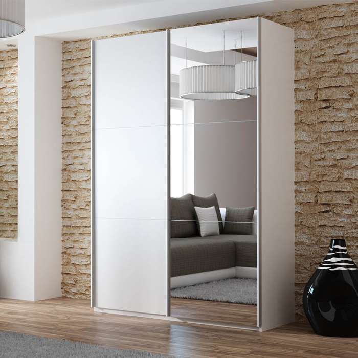 The sliding door wardrobe VIGO 150cm white with mirrored door in a room.