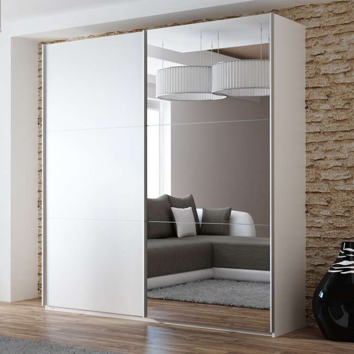 The sliding door wardrobe VIGO 200cm white with mirrored door in a room.