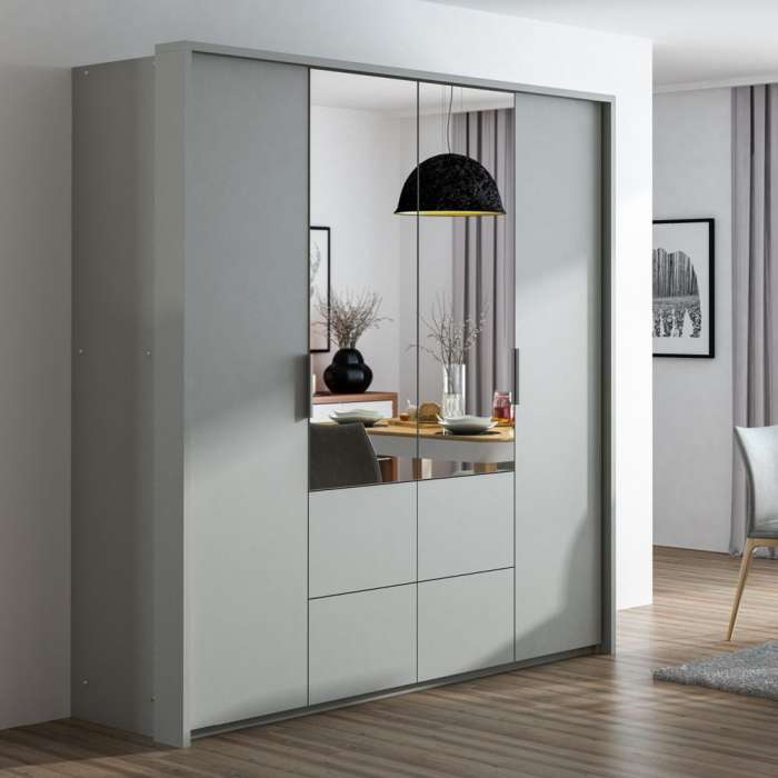 The WIEDEN white wardrobe in a bedroom.