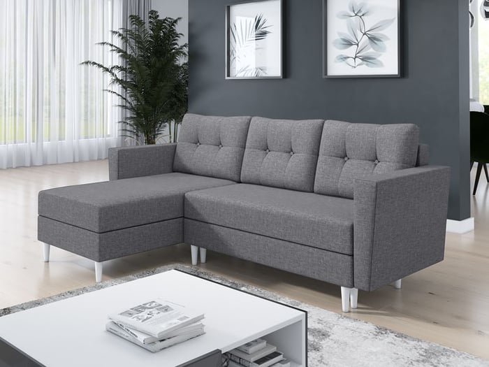 Corner Sofa Bed OTIS Light Grey in left orientation in a living room.