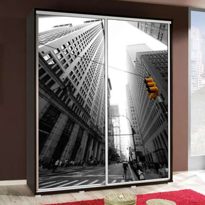 The PENELOPA 155cm sliding door wardrobe with a city image on the doors