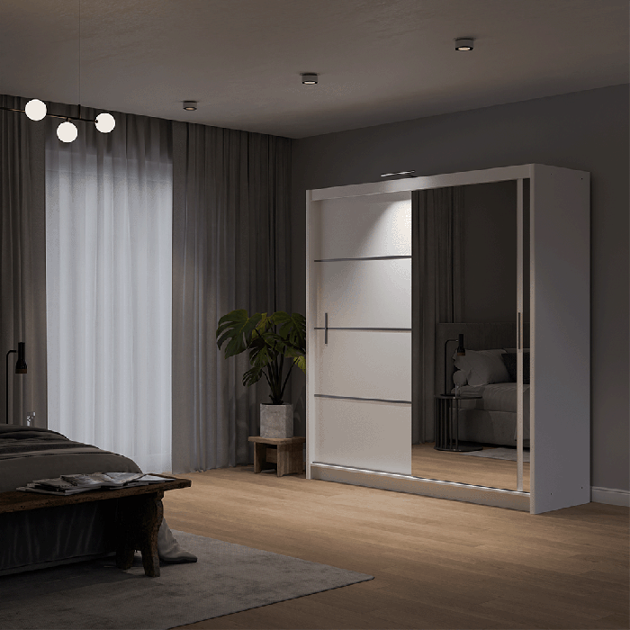 The sliding door VISTA 203cm white displaying the LED in a cosy bedroom.
