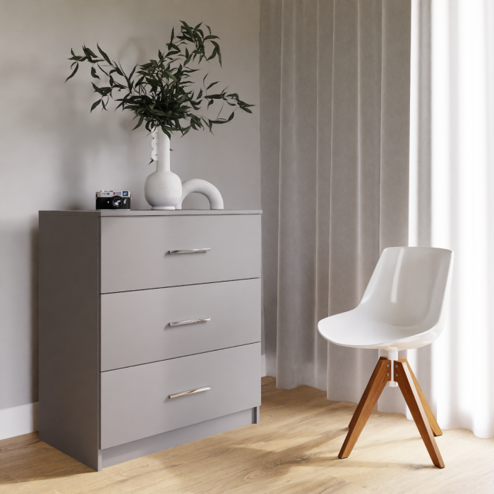 The graphite MARSYLIA chest of drawers in a cosy living room.