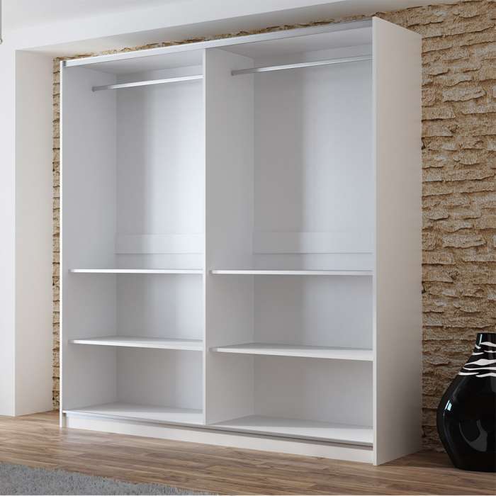 The interior of the VIGO 200cm wardrobe presenting a hanging rail and 2 shelves on each side of the wardrobe