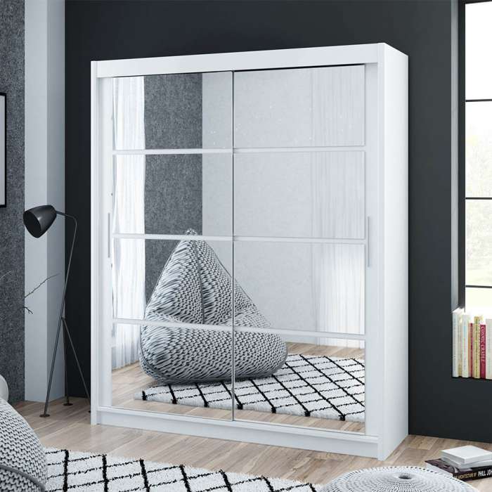 The sliding door DAKOTA 160cm white with mirrors in a cosy bedroom.