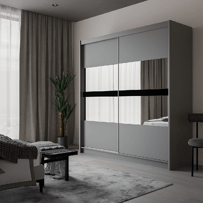 The sliding door wardrobe BATUMI 203cm graphite with mirrored doors in a cosy bedroom.