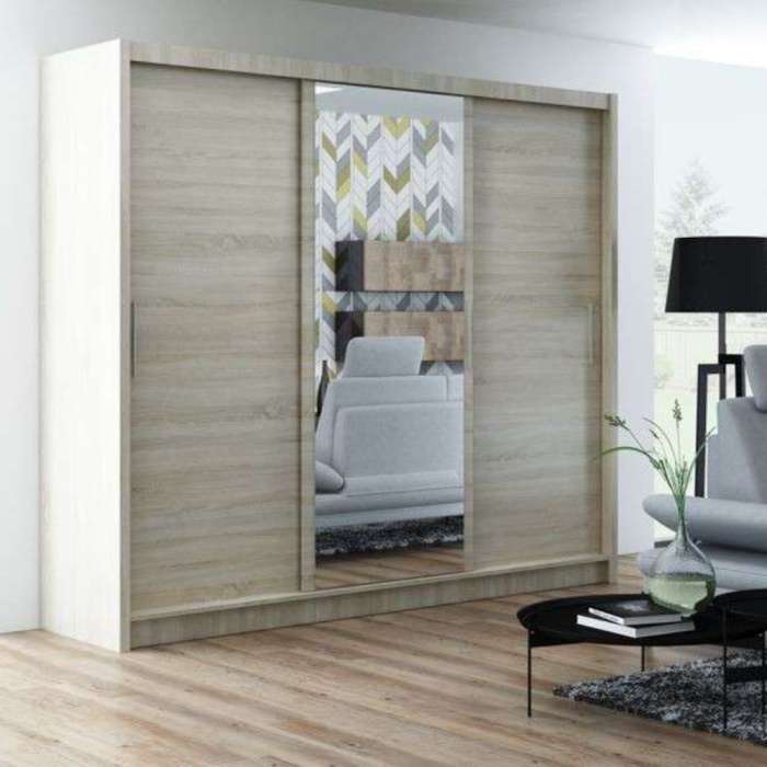 The sliding door wardrobe MONAKO 250cm oak sonoma with mirrored door in a cosy bedroom.