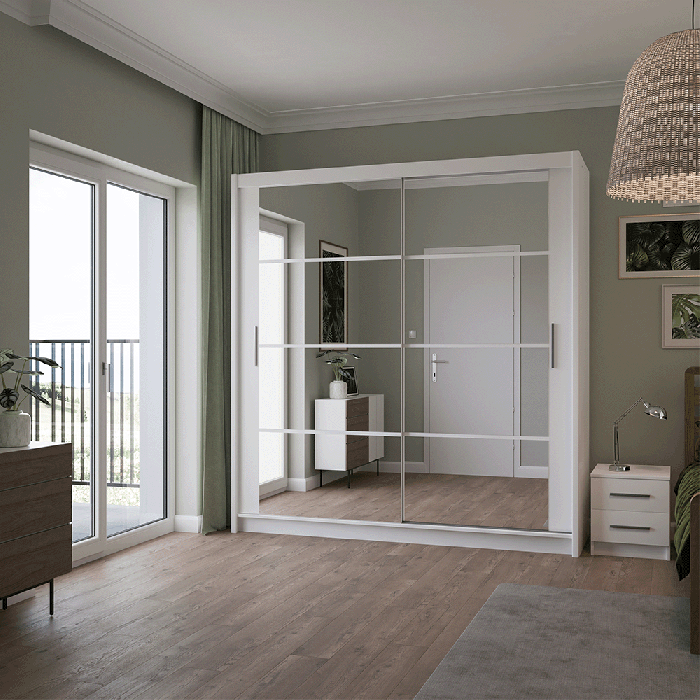 The sliding door DAKOTA 203cm white with mirrors in a cosy bedroom.