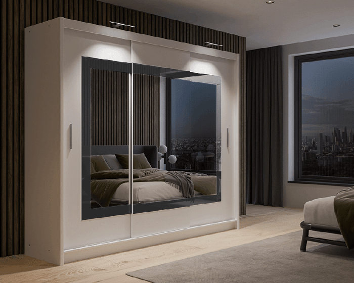 The sliding door wardrobe PRESTON 250cm white displaying a double LED in a cosy bedroom.