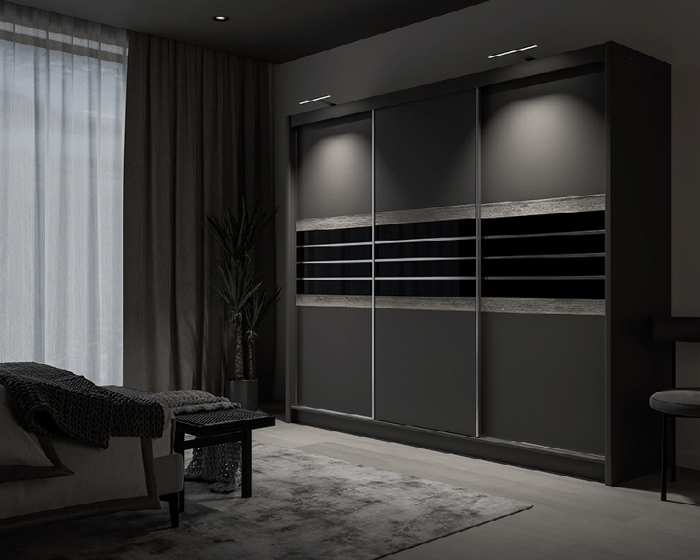 TURYN 250cm sliding door wardrobe lava / black glass with LED lights in a cosy bedroom.