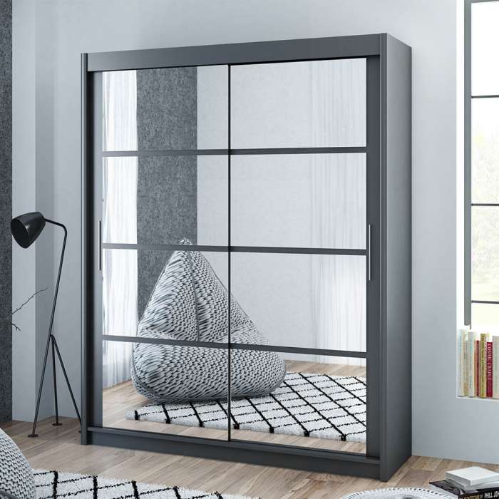 The sliding door DAKOTA 160cm graphite with mirrors in a cosy bedroom.