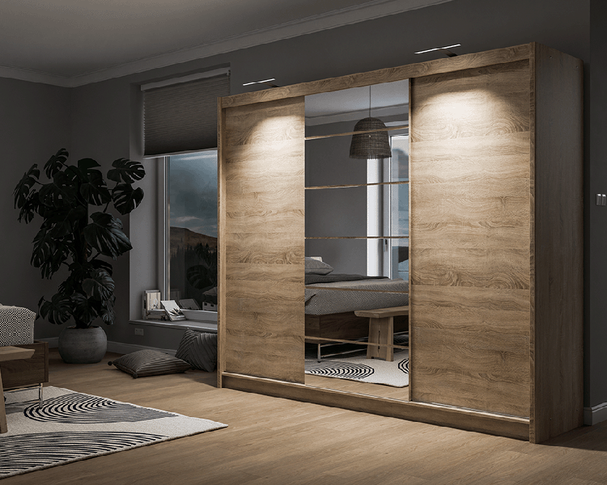 The sliding door wardrobe MALIBU oak sonoma with mirror, with LEDs in a cosy bedroom.