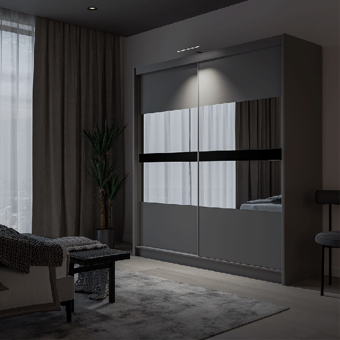 The sliding door BATUMI 203cm graphite displaying the LED in a cosy bedroom.