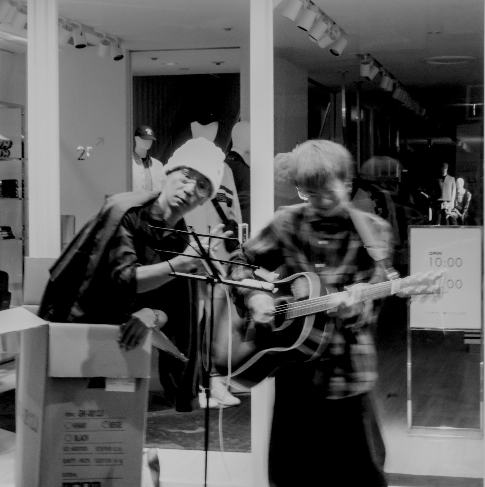 a young guitarist and his unc, who was in a box wearing a chikawa hat