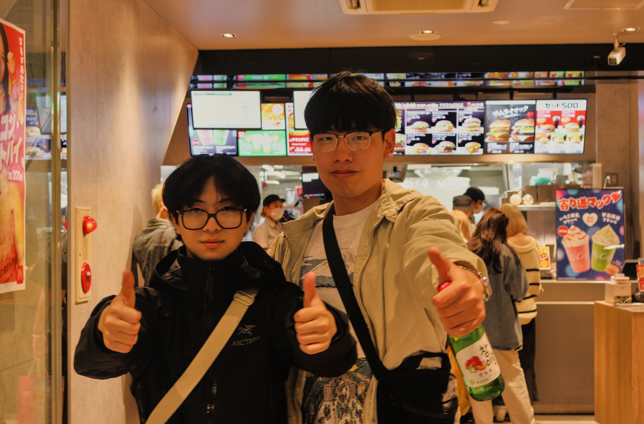 these dudes drinking soju in a mcdonalds