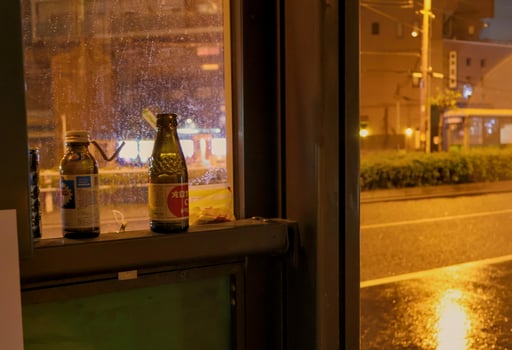 bus stop litter left uncleaned at night