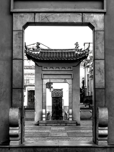 a courtyard with two gates