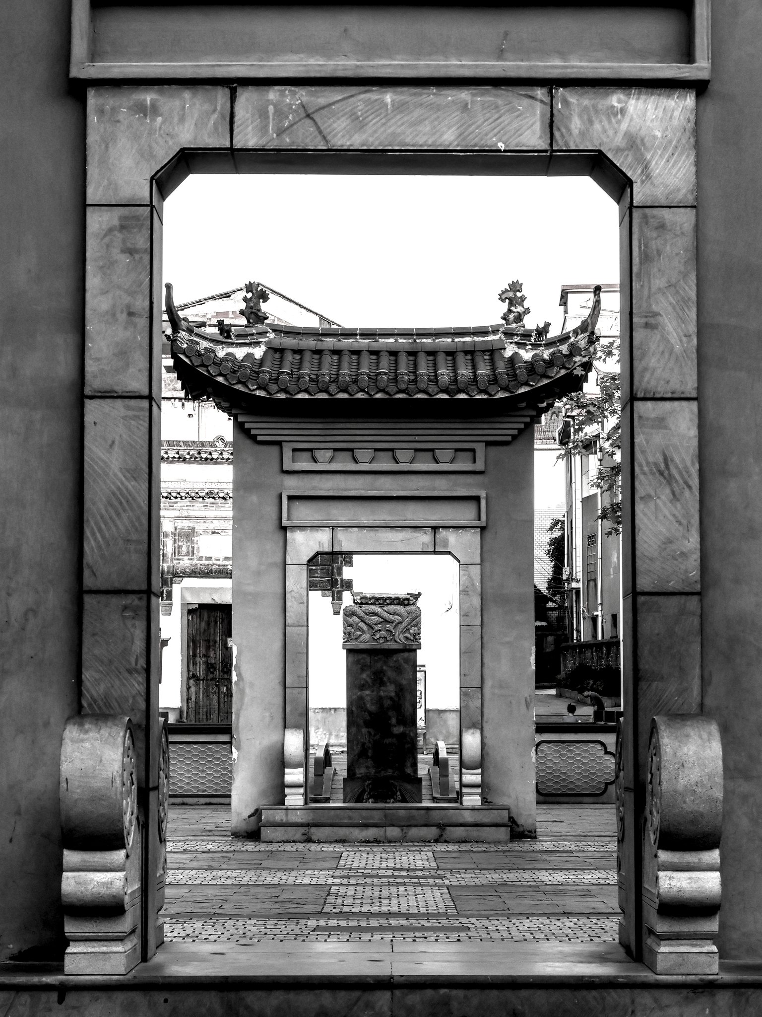 a courtyard with two gates