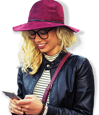 woman taking action on her phone after seeing a billboard advertisement for a restaurant