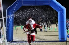 Green Wave Jingle Jam 5k logo