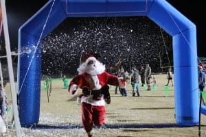 Green Wave Jingle Jam 5k Logo