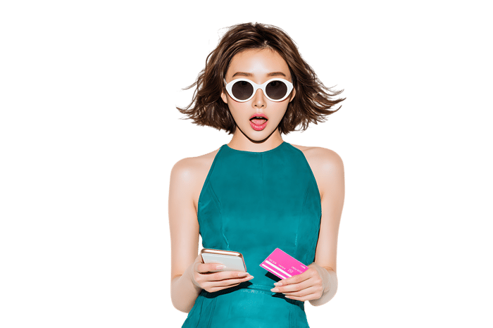 Surprised woman looking at her smartphone and credit card.