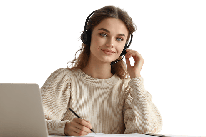 Smiling woman with headset working on laptop.
