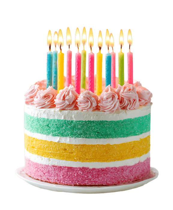 Colorful layered cake with lit candles