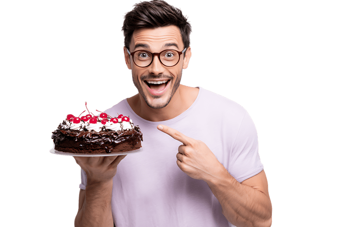 Man with glasses shows off chocolate cake