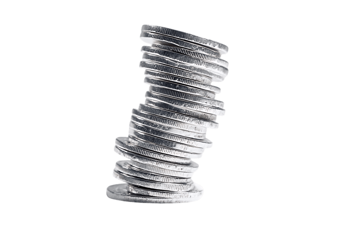 Stack of metal weights leaning precariously.