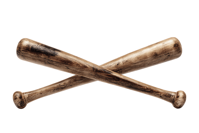Two weathered baseball bats crossed, isolated on black background.