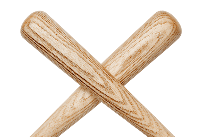 Two wooden baseball bats crossed on black background