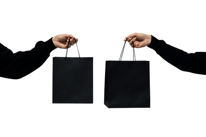 Two hands making gestures against a dark background. Ideal for communication, technology, or presentation visuals.
