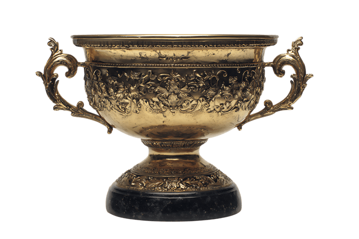Ornate gold trophy cup on black background.