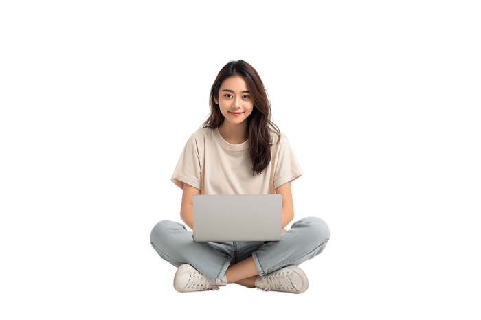 Young woman using laptop, sitting cross legged.